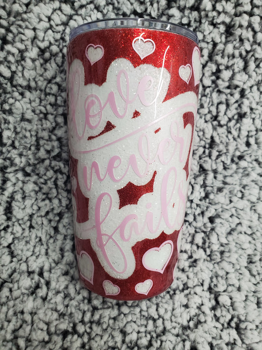 Red and White "Love Never Fails" 20-ounce Glitter Tumbler